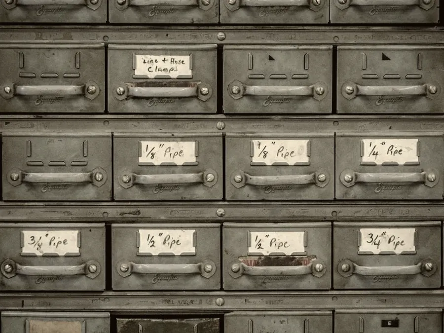 A wall of labelled catalogue drawers